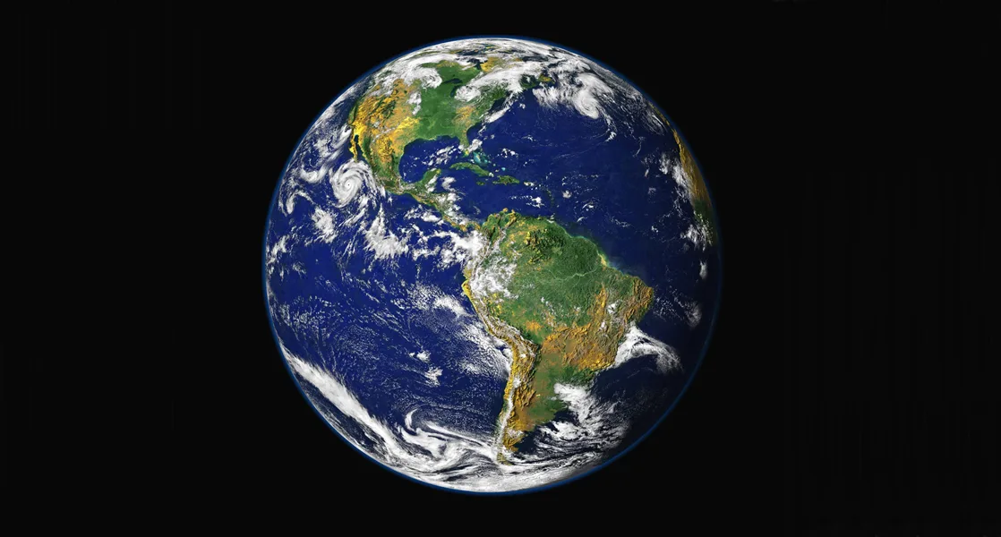 A composite satellite photograph of Earth from space, showing blue oceans, brown and green continents, and swirls of white cloud.