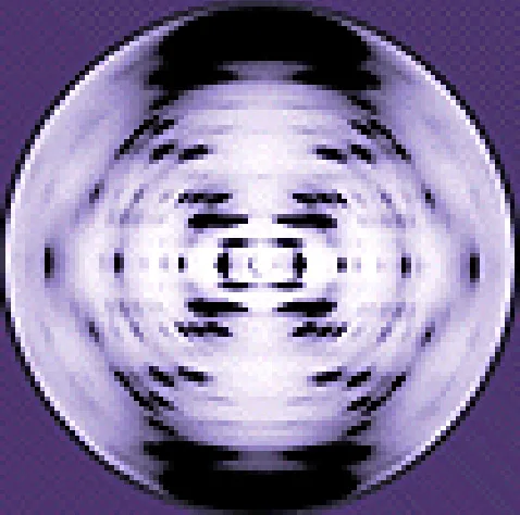 A purple-tinted photograph of an X-ray diffraction pattern: a fuzzy, roughly circular arrangement of dark spots forming an X-shaped or figure-eight pattern around a brighter center, characteristic of a helical molecule.